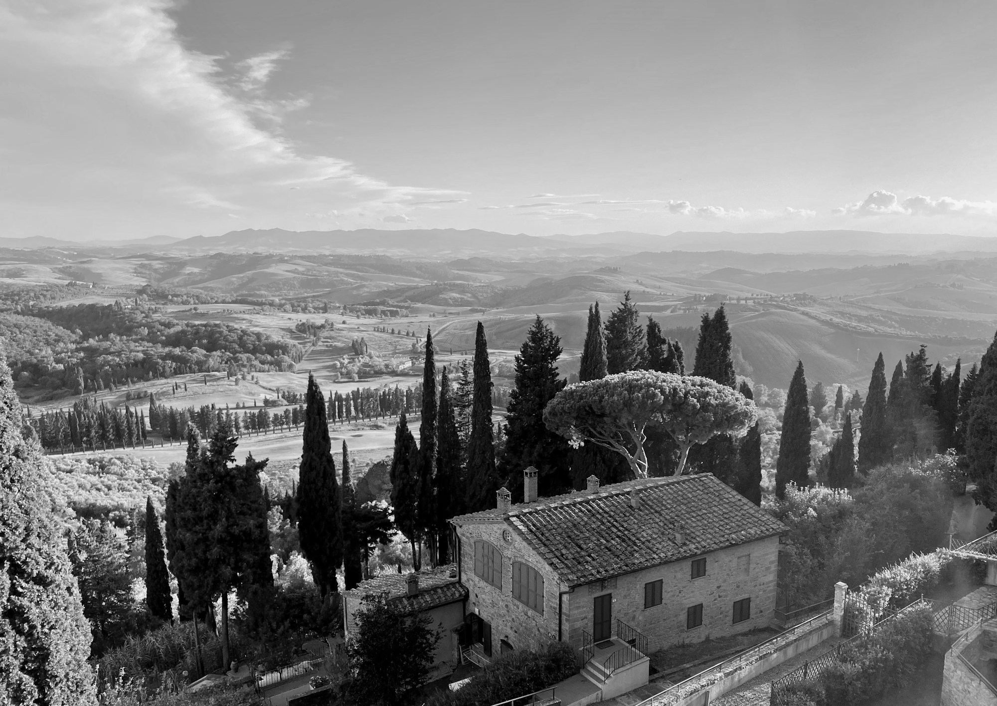 Stone villa among cypress trees in Tuscany, Italy